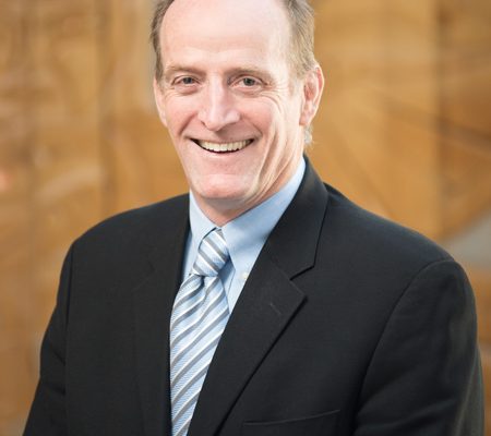 An indoor portrait picture of Director of Instruction Ian Kennedy