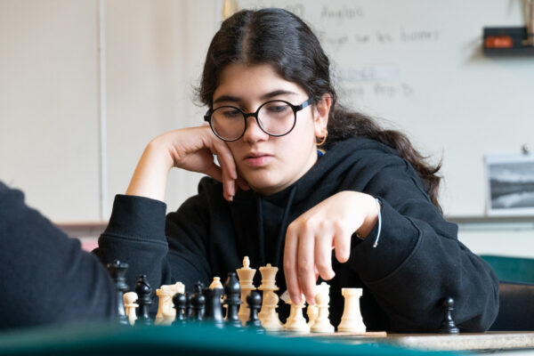 A photo of a student playing chess
